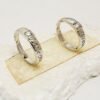 Silver colored love rings